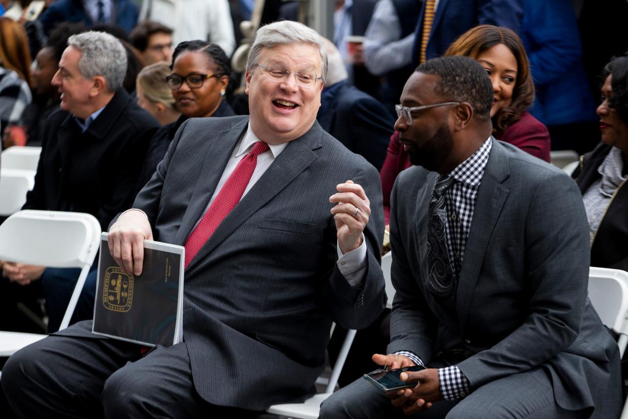 Memphis Mayor Jim Strickland laughs while speaking with Memphis Mayor-elect Paul Young during the ceremonial groundbreaking for 100 N. Main redevelopment in Downtown Memphis on Thursday, November 30, 2023.