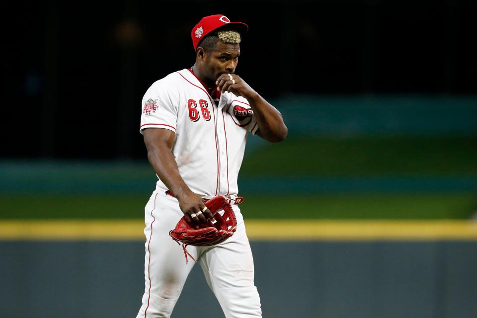 Cincinnati Reds right fielder Yasiel Puig (66) exits the field for the final time as a Reds player at the end of the top of the ninth inning of the MLB National League game between the Cincinnati Reds and the Pittsburgh Pirates at Great American Ball Park in downtown Cincinnati on Tuesday, July 30, 2019. The Pirates won 11-4.