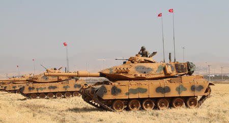 Turkish army tanks are seen during a military exercise near the Turkish-Iraqi border in Silopi, Turkey, September 18, 2017. Mehmet Selim Yalcin/Dogan News Agency, DHA via REUTERS