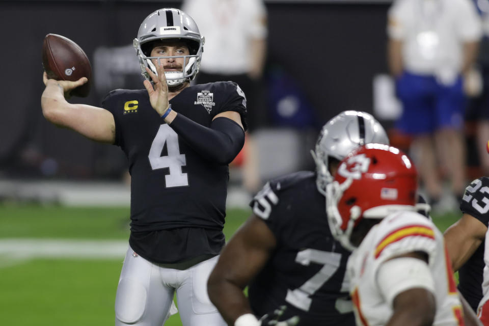 Las Vegas Raiders quarterback Derek Carr (4) throws against the Kansas City Chiefs during the first half of an NFL football game, Sunday, Nov. 22, 2020, in Las Vegas. (AP Photo/Isaac Brekken)