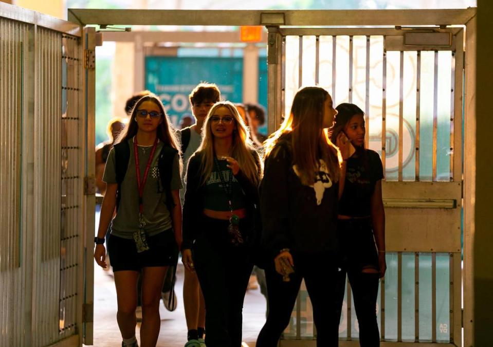 Students arrive during the first day of school at Coral Glades High School in Coral Springs on Tuesday, Aug. 16, 2022.