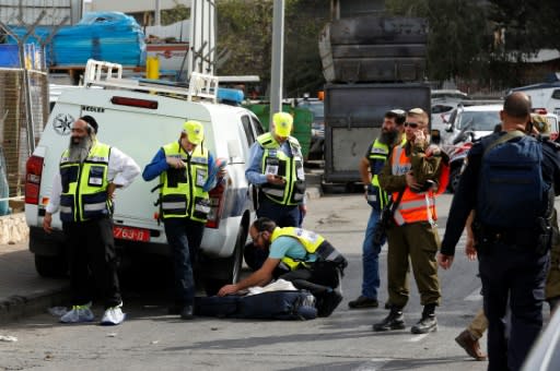 Members of Israel's rescue and reovery volunteer organisation Zaka gather at the site of a shooting attack at the Barkan Industrial Park near the Israeli settlement of Ariel in the occupied West Bank on October 7, 2018