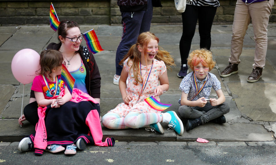 <p>A family sit on the side of the road watching the York Pride parade on June 9, 2018 in York, England. The parade made its way through the streets of the city centre before reaching the Knavesmire area of the city where live entertainment was performed for the crowds. (Photo: Ian Forsyth/Getty Images) </p>