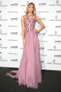 Date-to-night made easy. Karlie Kloss attended the amfAR event in the same pink dress she had just walked down the runway in a mere few hours before. “I came straight from the Versace couture runway,” the model admitted to WWD.