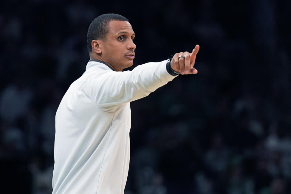 Boston Celtics coach Joe Mazzulla gestures to players during the first half of the team's NBA preseason basketball game against the Toronto Raptors, Wednesday, Oct. 5, 2022, in Boston. (AP Photo/Charles Krupa)