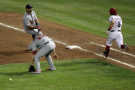 ARLINGTON, TX - OCTOBER 24: Chris Carpenter #29 of the St. Louis Cardinals makes an error on a ball hit by Ian Kinsler #5 of the Texas Rangers in the fifth inning during Game Five of the MLB World Series at Rangers Ballpark in Arlington on October 24, 2011 in Arlington, Texas. (Photo by Ezra Shaw/Getty Images)