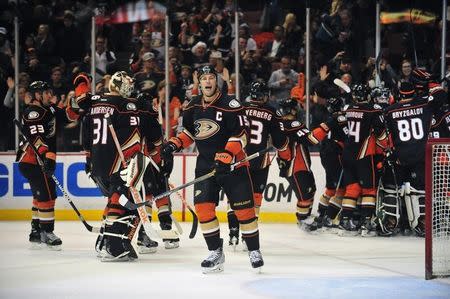 December 28, 2014; Anaheim, CA, USA; Anaheim Ducks center Ryan Getzlaf (15) celebrates the goal scored by defenseman Cam Fowler (4) against the Vancouver Canucks during the overtime period at Honda Center. Getzlaf recorded an assist on the goal. Mandatory Credit: Gary A. Vasquez-USA TODAY Sports