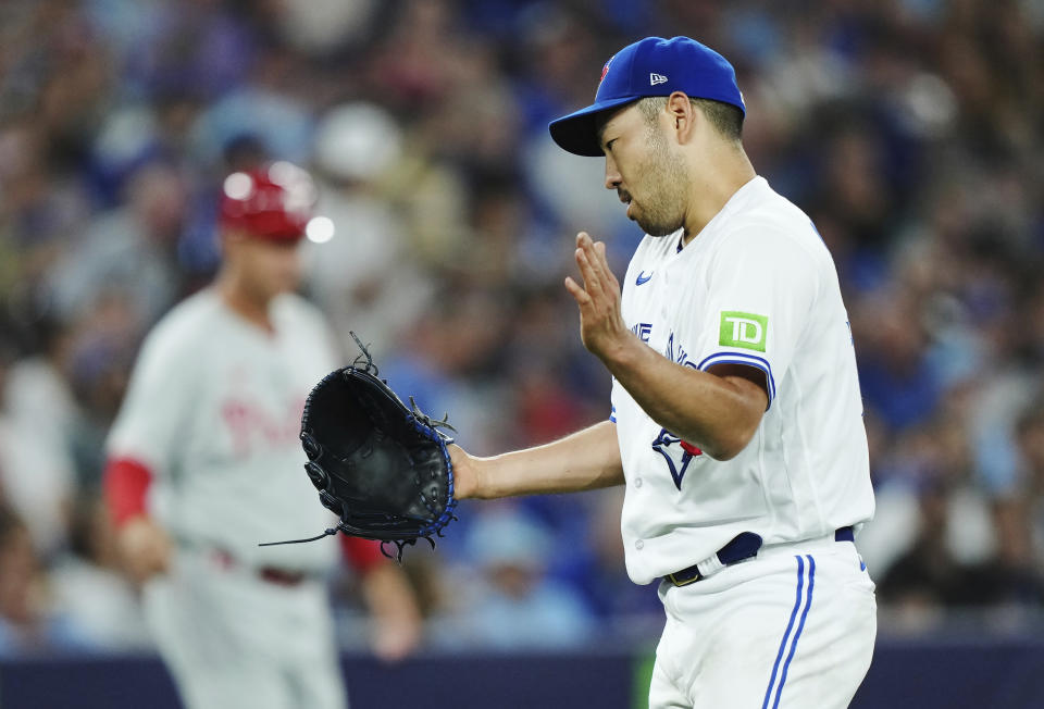 Toronto Blue Jays starting pitcher Yusei Kikuchi (16) reacts during the sixth inning of a baseball game against the Philadelphia Phillies in Toronto, Tuesday, Aug. 15, 2023. (Nathan Denette/The Canadian Press via AP)