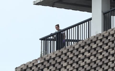  police officer looks out from the viewing platform at the Tate Modern art gallery, following the arrest of a 17-year-old male - Credit: PA