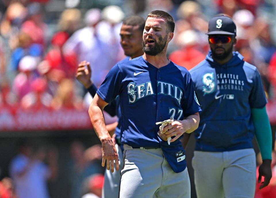 Mariners outfielder Jesse Winker is finally separated from the pack after benches had cleared in Sunday's brawl with the Angels.