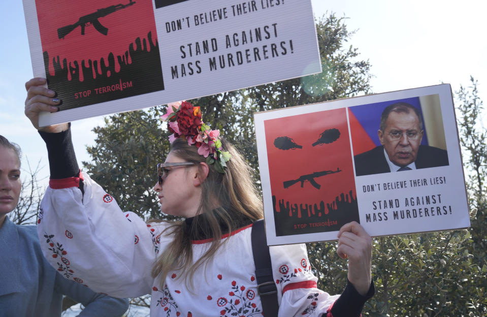 Demonstrators protest against the war in Ukraine at a venue where the Russian and Chinese foreign ministers are set to meet with their counterparts from the BRICS economic bloc of developing nations in Cape Town, South Africa Thursday, June 1, 2023. The meeting is a precursor to a larger summit of developing nations in South Africa in August that Russian President Vladimir Putin may attend while under indictment by the International Criminal Court. (AP Photo/Nardus Engelbrecht)