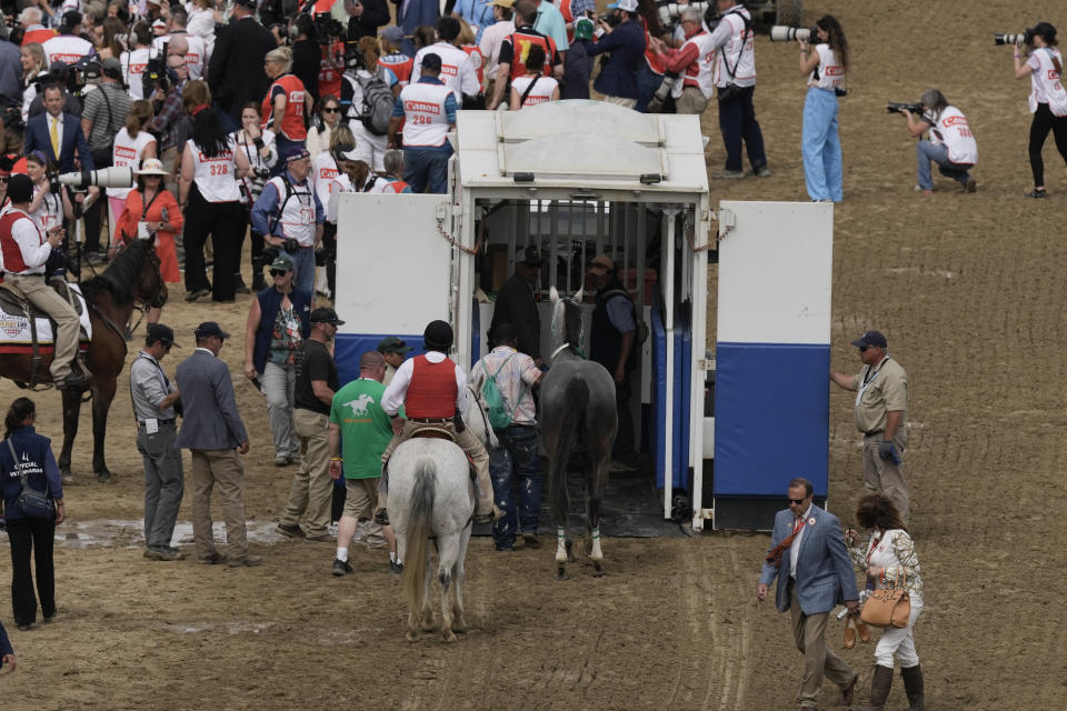 Here Mi Song is taken by an equine ambulance after the 10th horse race at Churchill Downs Saturday, May 6, 2023, in Louisville, Ky. (AP Photo/Charlie Riedel)