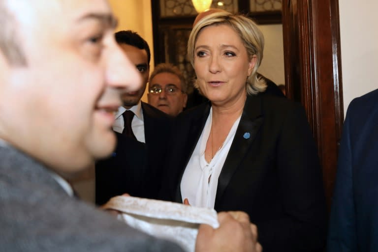 France's far-right presidential candidate Marine Le Pen rejects a headscarf ahead of her meeting with Lebanon's Grand Mufti Sheikh Abdullatif Deryan in Beirut on February 21, 2017