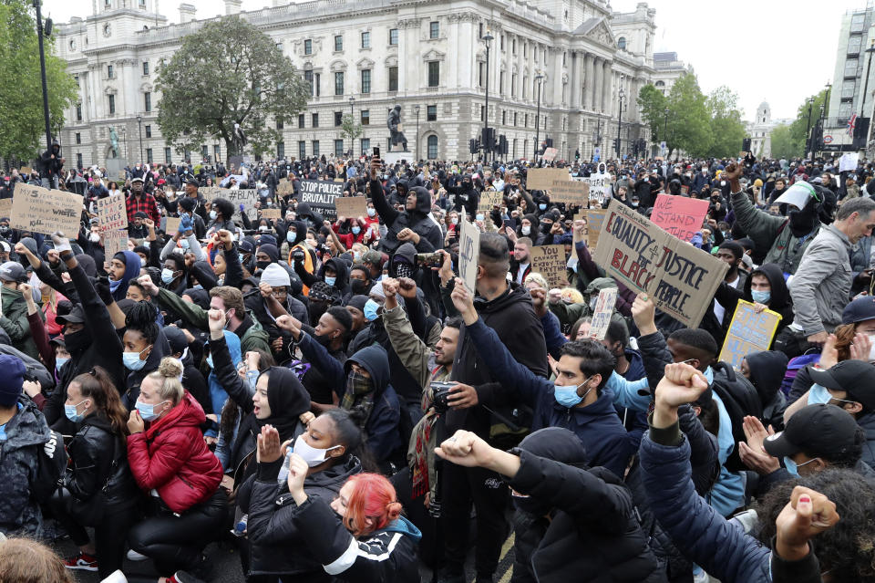 Protesters gather in Parliament Square during the Black Lives Matter protest rally in Whitehall, London, in memory of George Floyd who was killed on May 25 while in police custody in the U.S. city of Minneapolis. (Gareth Fuller/PA via AP)