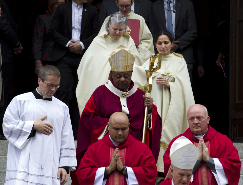 FILE - In this Oct. 6, 2019, file photo, Washington D.C. Archbishop Wilton Gregory, accompanied by other members of the clergy, leaves St. Mathews Cathedral after the annual Red Mass in Washington. Pope Francis on Sunday, Oct. 25, 2020, named 13 new cardinals, including Washington D.C. Archbishop Wilton Gregory, who would become the first Black U.S. prelate to earn the coveted red hat. In a surprise announcement from his studio window to faithful standing below in St. Peter’s Square, Francis said the churchmen would be elevated to a cardinal’s rank in a ceremony on Nov. 28. (AP Photo/Jose Luis Magana, File)