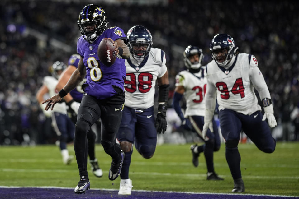 Baltimore Ravens quarterback Lamar Jackson (8) runs into the end zone for a touchdown against the Houston Texans during the second half of an NFL football AFC divisional playoff game, Saturday, Jan. 20, 2024, in Baltimore. (AP Photo/Nick Wass)