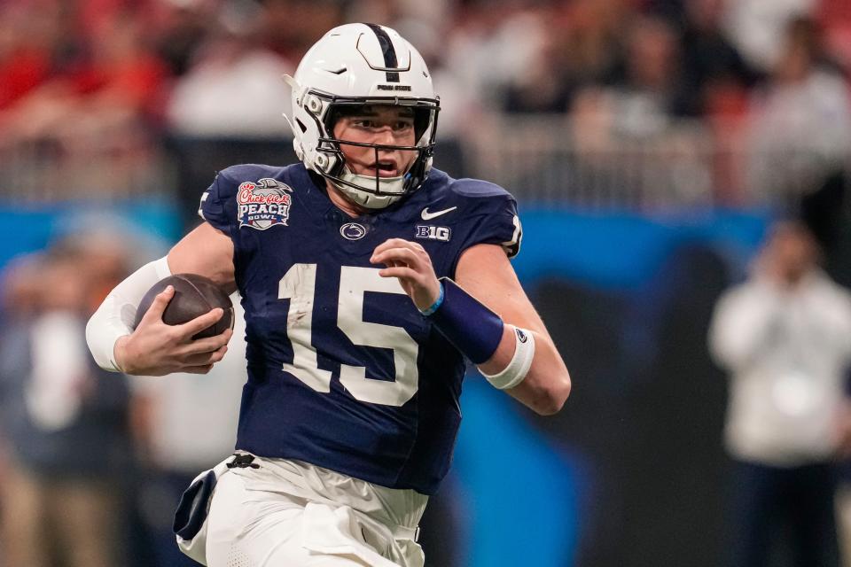 Dec 30, 2023; Atlanta, GA, USA; Penn State Nittany Lions quarterback Drew Allar (15) runs with the ball against the Mississippi Rebels during the second half at Mercedes-Benz Stadium. Mandatory Credit: Dale Zanine-USA TODAY Sports