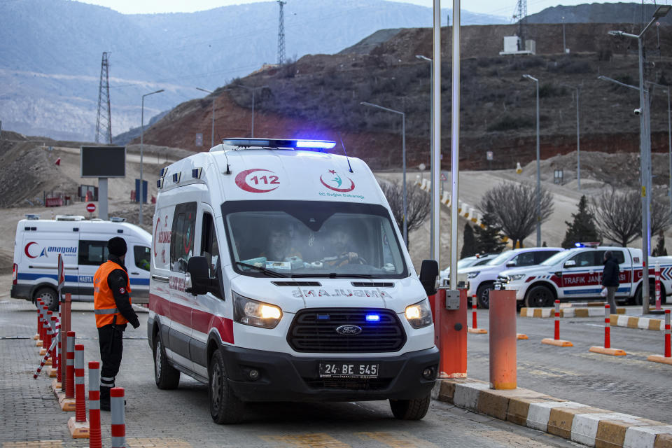 An ambulance leaves the Copler gold mine near Ilic village, eastern Turkey, Wednesday, Feb. 14, 2024. Hundreds of rescuers on Wednesday pressed ahead with efforts to search for several workers trapped at a gold mine in eastern Turkey that was engulfed by a massive landslide. (Ugur Yildirim/Dia images via AP)