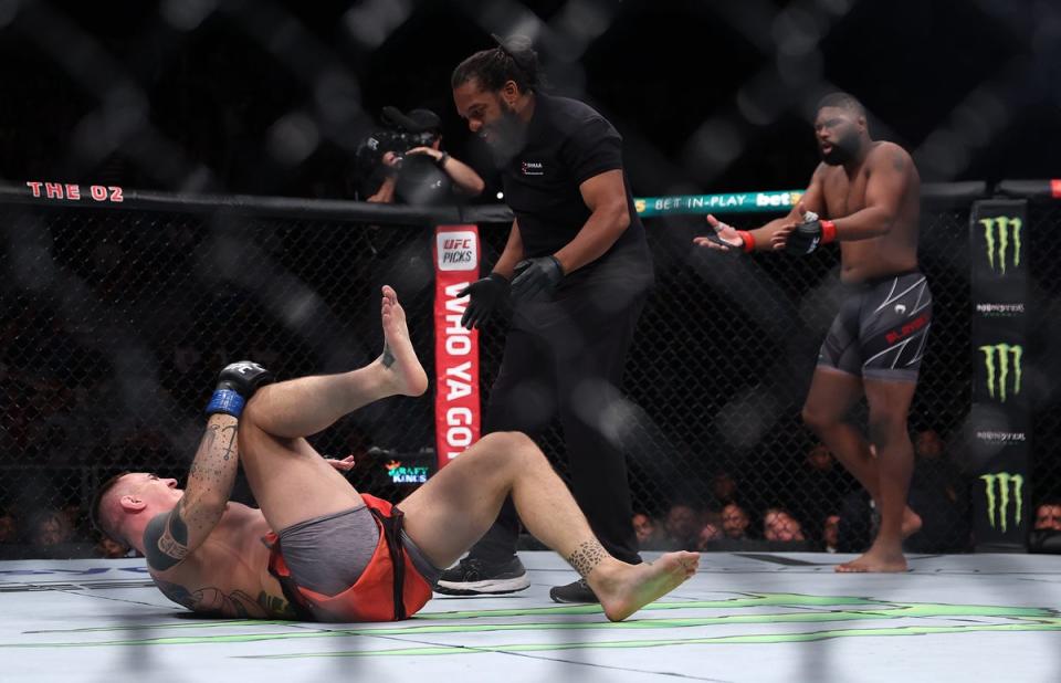 Curtis Blaydes (right) reacts in shock to Tom Aspinall’s early injury (Getty Images)