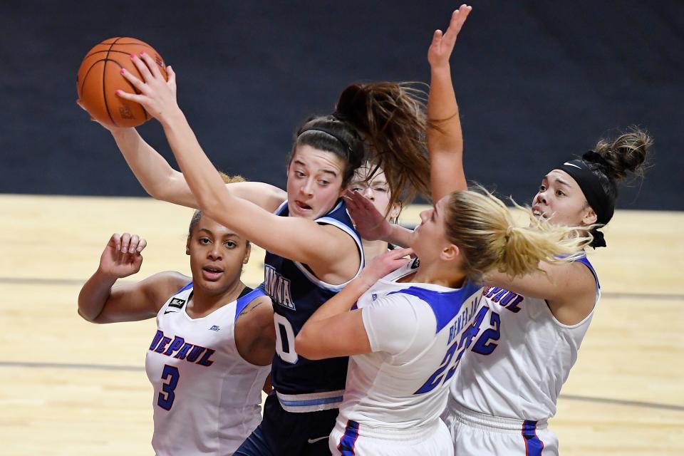 Villanova's Maddy Siegrist pulls down a rebound against DePaul during the second half of an NCAA college basketball game in the quarterfinals of the Big East Conference tournament at Mohegan Sun Arena, Saturday, March 6, 2021, in Uncasville, Conn. (AP Photo/Jessica Hill)