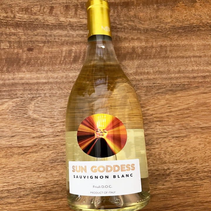 A bottle of sauvignon blanc on a wooden table