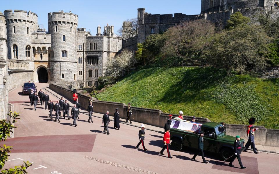 The Royal Family walk behind Prince Philip, Duke of Edinburgh's coffin, carried by a Land Rover hearse, in the procession before the funeral - Paul Edwards/WPA Pool/Getty Images