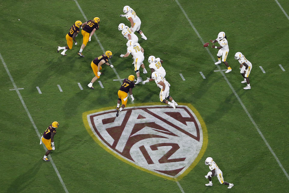 FILE - The Pac-12 logo is shown during the second half of an NCAA college football game between Arizona State and Kent State, in Tempe, Ariz. on Aug. 29, 2019. The Pac-12 announced, Wednesday, May 18, 2022, it was scrapping its divisional format for the coming season Wednesday, May 18, 2022. (AP Photo/Ralph Freso, File)