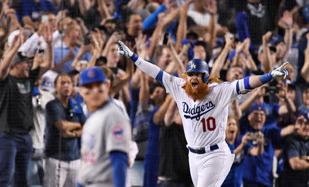 Oct 15, 2017; Los Angeles, CA, USA; Los Angeles Dodgers third baseman Justin Turner (10) runs home after hitting a three RBI home run against the Chicago Cubs in the ninth inning during game two of the 2017 NLCS playoff baseball series at Dodger Stadium. Mandatory Credit: Robert Hanashiro-USA TODAY Sports