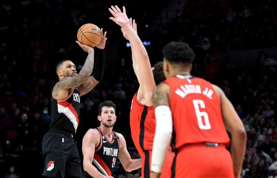 Portland Trail Blazers guard Damian Lillard hits a three-point shot against the Houston Rockets during the second half of a game in Portland, Ore., Feb. 26, 2023. Lillard scored a franchise-record 71 points as the Blazers won 131-114.