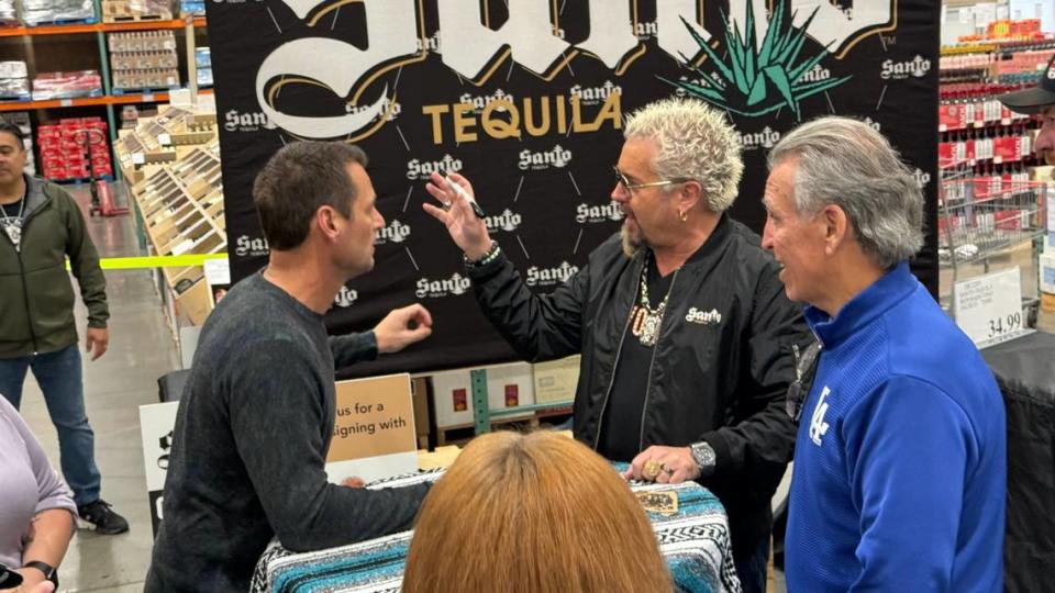 Guy Fieri talks to fans while signing bottles of his Santo Tequila on March 6, 2024, at Costco in San Luis Obispo.