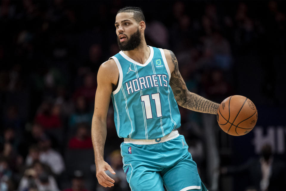 Charlotte Hornets forward Cody Martin (11) brings the ball up court during the first half of an NBA basketball game against the Philadelphia 76ers, Wednesday, Dec. 8, 2021, in Charlotte, N.C. (AP Photo/Matt Kelley)