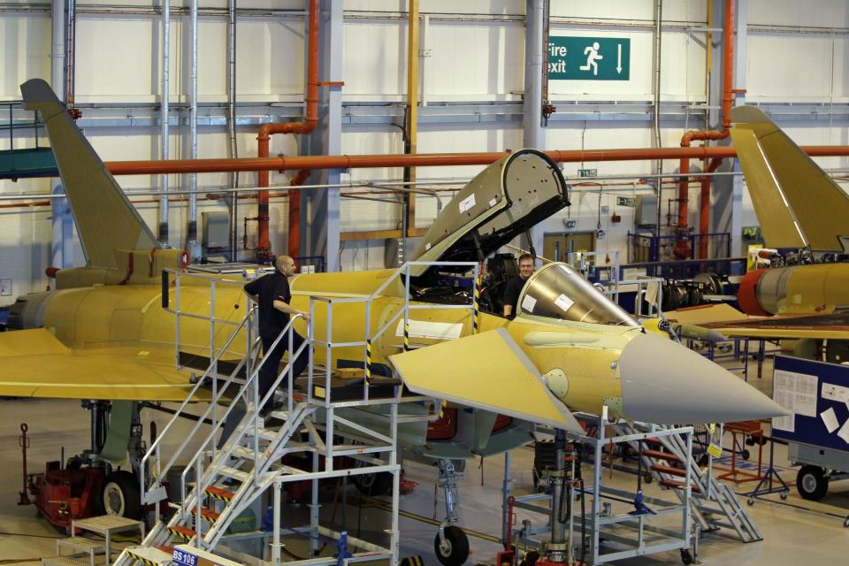Employees at work on a Eurofighter Typhoon at BAE Systems, Warton Aerodrome, in Lancashire: PA