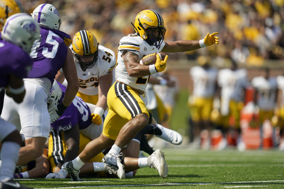 Missouri running back Cody Schrader runs with the ball during the first half of an NCAA college football game against Abilene Christian Saturday, Sept. 17, 2022, in Columbia, Mo. (AP Photo/Jeff Roberson)