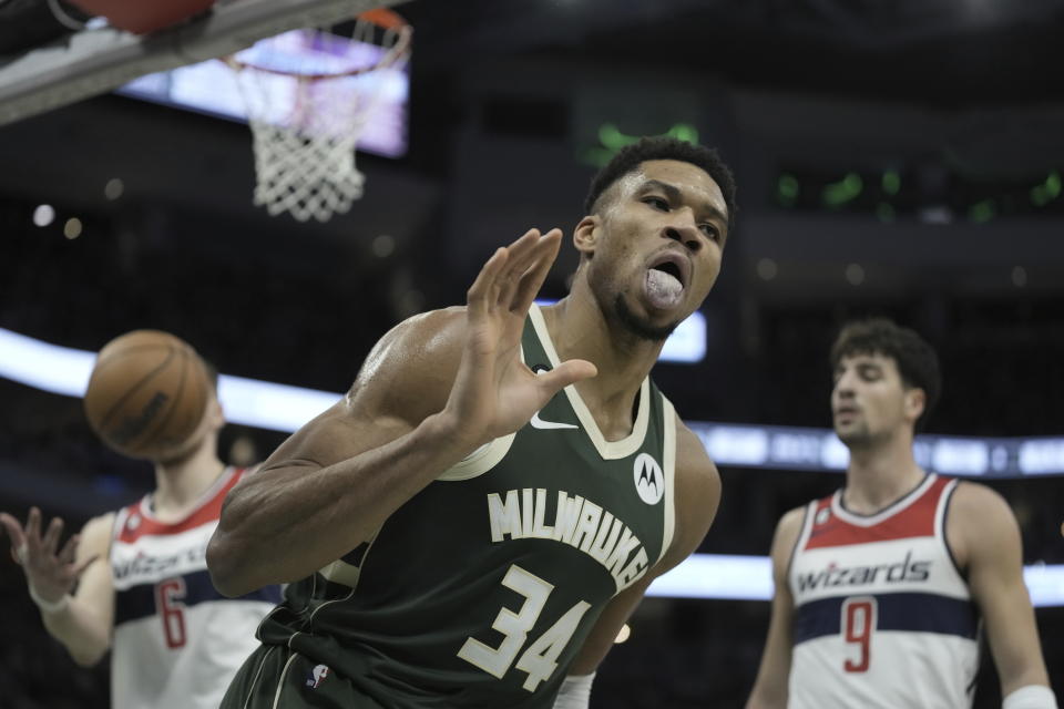 Milwaukee Bucks' Giannis Antetokounmpo reacts after making a basket during the first half of an NBA basketball game Tuesday, Jan. 3, 2023, in Milwaukee. (AP Photo/Morry Gash)