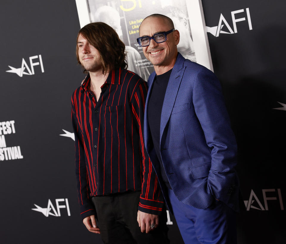 US actor Robert Downey Jr. (L) and son, Indio Falconer Downey arrive for the premiere of 