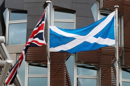 The Union Flag and The Saltire fly outside the Scottish Parliament in Holyrood Edinburgh, Scotland