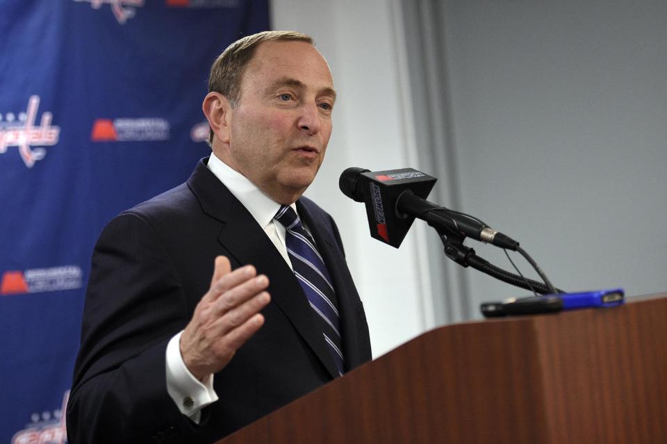 NHL commissioner Gary Bettman speaks to reporters before an NHL hockey game between the Pittsburgh Penguins and the Washington Capitals, Wednesday, Feb. 25, 2015, in Washington. (AP Photo/Nick Wass)