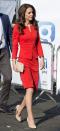 <p>In a bright red, figure-flattering Armani skirt suit, beige clutch and beige Rupert Sanderson pumps at the opening of The Global Academy in partnership with the Heads Together charity.</p>