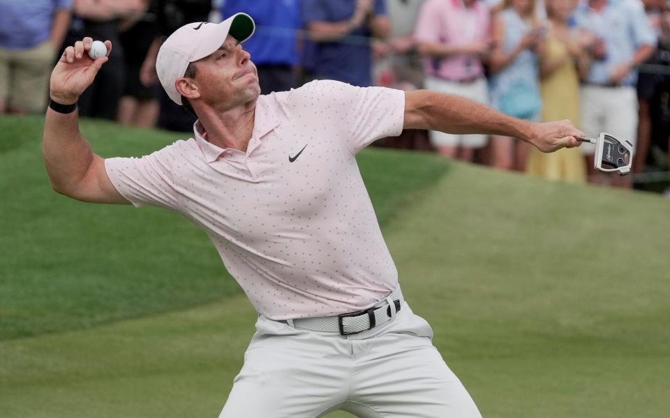 Rory McIlroy tosses his ball in celebration on the 18th green during the final round of the Wells Fargo Championship  - USA Today