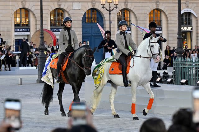 <p>Kristy Sparow/Getty </p> Kendall Jenner and Gigi Hadid at Vogue World: Paris on June 23