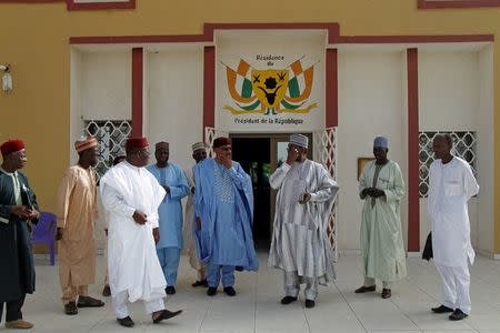 Niger's Interior Minister Mohamed Bazoum (4th from R) stands with members of his delegation at the official presidential residence in Diffa, in southeastern Niger, June 18, 2016. REUTERS/Luc Gnago