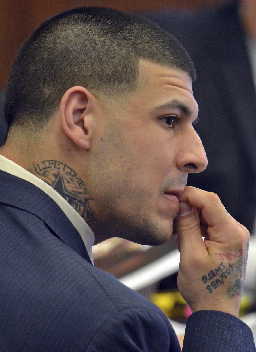 Former New England Patriots tight end Aaron Hernandez listens to testimony during his double murder trial in Suffolk Superior Court in Boston on Friday, March 17, 2017. Hernandez is on trial for the July 2012 killings of Daniel de Abreu and Safiro Furtado who he encountered in a Boston nightclub. The former NFL player is already serving a life sentence in the 2013 killing of semi-professional football player Odin Lloyd. (Chris Christo/The Boston Herald via AP, Pool)