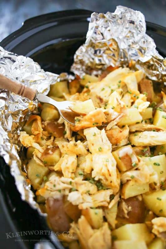 <p>This cozy dish cooks up perfectly in your slow cooker. Get the recipe <a href="http://www.kleinworthco.com/2016/04/cheesy-chicken-ranch-potatoes.html" rel="nofollow noopener" target="_blank" data-ylk="slk:HERE;elm:context_link;itc:0;sec:content-canvas" class="link "><strong>HERE</strong></a>.</p>