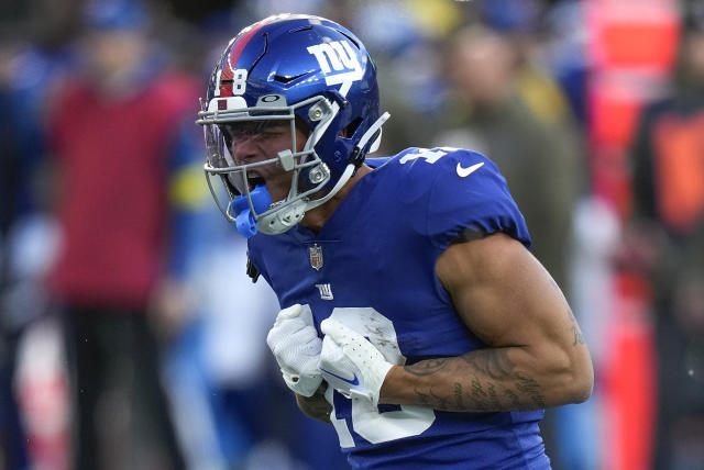 New York Giants running back Saquon Barkley (26) walks off the field after  playing against the Houston Texans in an NFL football game, Sunday, Nov. 13,  2022, in East Rutherford, N.J. (AP