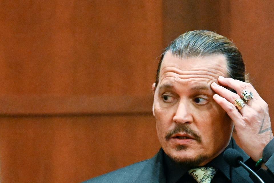 Johnny Depp testifies during a hearing at the Fairfax County Circuit Court in Fairfax, Va., Tuesday April 19, 2022.