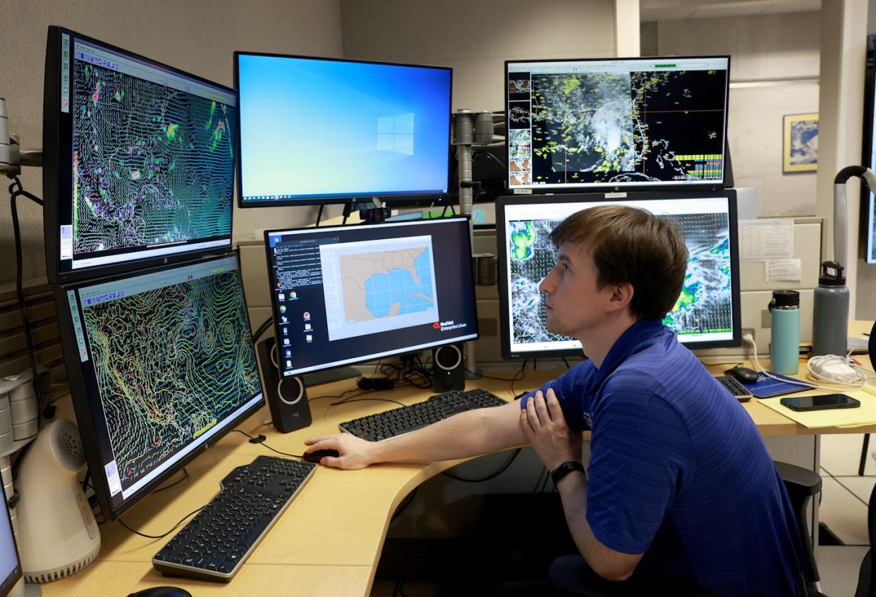 A worker at the National Hurricane Center tracks weather over the Gulf of Mexico. <a href="https://www.gettyimages.com/detail/news-photo/philippe-papin-hurricane-specialist-at-the-national-news-photo/1494908383" rel="nofollow noopener" target="_blank" data-ylk="slk:Joe Raedle/Getty Images;elm:context_link;itc:0;sec:content-canvas" class="link ">Joe Raedle/Getty Images</a>