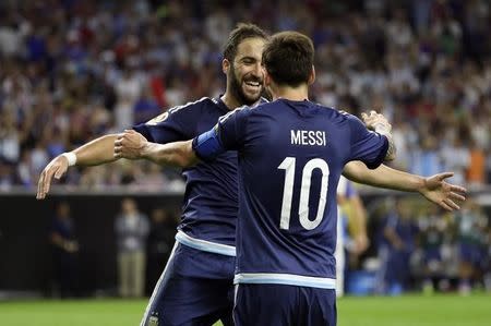 Jun 21, 2016; Houston, TX, USA; Argentina forward Gonzalo Higuain (left) celebrates with midfielder Lionel Messi (10) after scoring a goal during the second half against the United States in the semifinals of the 2016 Copa America Centenario soccer tournament at NRG Stadium. Kevin Jairaj-USA TODAY Sports