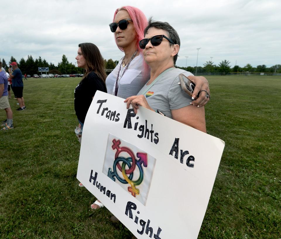 Jodi Perko, right, Shay Beaverson, center, Nicole Edwardson, were some of the counterprotestors that showed up to the rally held at Rotary Park Thursday, July 13, 2023.