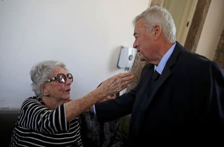 Former President of the Brazilian Soccer Confederation, Ricardo Teixeira (R), greets Anna Maria Hermanny, widow of former FIFA President Joao Havelange, at the wake for Havelange in Rio de Janeiro, August 16, 2016. REUTERS/Nacho Doce