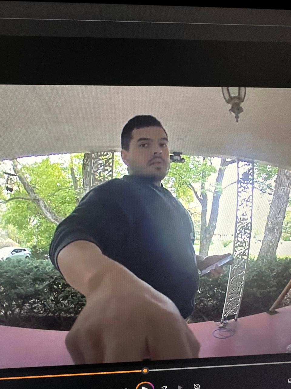 The Monroe County Prosecutor's Office has issued an arrest warrant for Juan Romero of Berwyn, Illinois, who the Monroe County Sheriff's Office says is pictured here in a doorbell camera image. Romero is accused of defrauding a Summerfield Township woman of between $1,000 and $20,000.